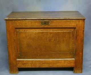 A 17th Century oak coffer of panelled construction 35"