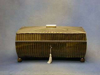 A Regency cow horn and ivory twin compartment tea caddy, the interior fitted a glass mixing bowl and 2 caddies, raised on bun feet (formerly the property of a member of the Brook Bond Family, complete with letter of provenance) 14"