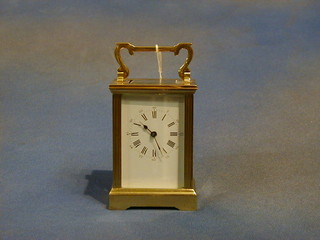 A 19th Century French 8 day carriage clock with enamelled dial and Roman numerals