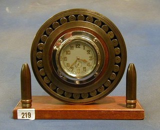 A WWI German aircraft bearing set an 8 day car clock and supported by 2 canon shells
