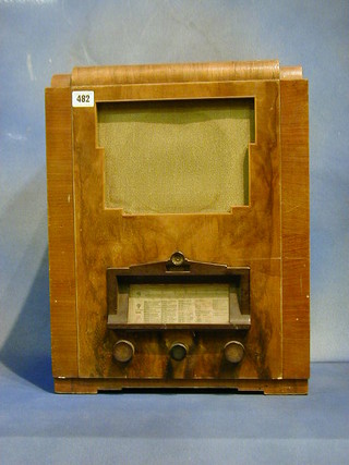 A 1930's radio by Harrods contained in a walnutwood case  15"