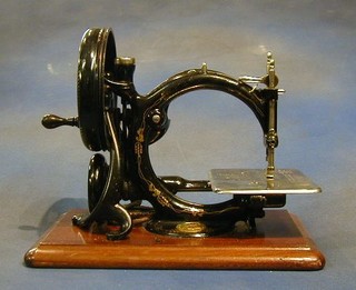 A Willcock & Gibbs portable manual sewing machine complete with instructions and carrying case
