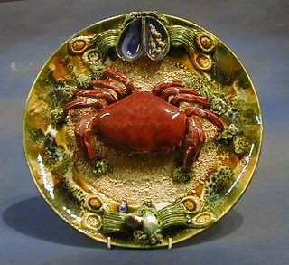 A Continental Majolica plate decorated a crab 14"