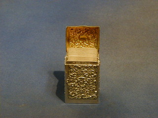 An Edwardian embossed silver card case with hinged lid and contents of cards Birmingham 1909