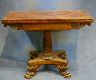 A fine quality William IV carved mahogany card table, raised on a turned and carved column with triform base and raised on 4 hoof supports 36"