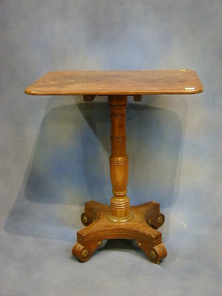 A William IV rectangular mahogany snap top wine table raised on a turned column and triform base 26"