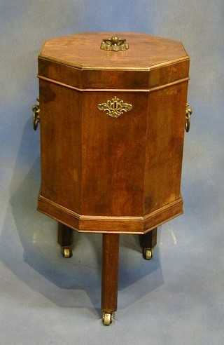 A Georgian octagonal cellarette with hinged lid, raised on chamfered supports 15"