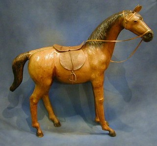 A leather figure of a standing pony, 37" high