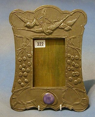 An Art Nouveau embossed pewter easel photograph frame decorated diving birds and inset hardstones 12"
