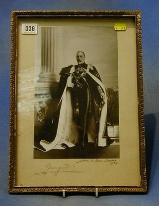 A black and white portrait photograph of HM King George V wearing the uniform of an Admiral of the Fleet and the mantel of the Order of the Garter by John ? ?, dated 1934 and signed in pencil by King George V 11" x 7"