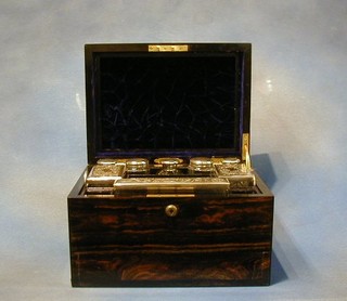 A lady's fine quality Victorian Coromandel travelling vanity box the interior fitted glass bottles and accessories with silver plated mounts