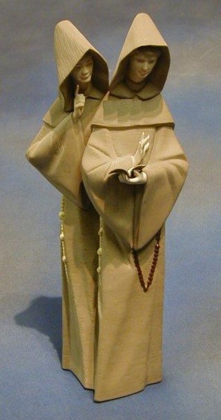 A Lladro figure of 2 standing monks, the base marked Lladro with matt finish 14"