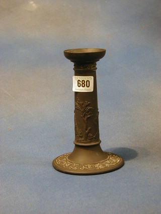 A Wedgwood black basalt candlestick decorated classical figures, the base impressed Wedgwood 7"