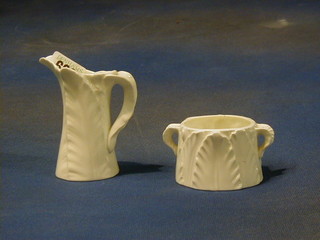 A Royal Worcester leaf pattern cream jug 4" and a circular twin handled sugar bowl