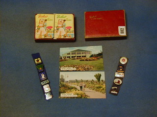 11 Butlin's enamelled badges, Skegness 1955, Minehead 1966, Skegness 1966, Butlins Filey, Barry Island, Butlins Aire 1966, Filey 1961, Clacton 1966, Bognor Regis 1967 and Butlins Beaver Club Skegness 1967, 3 postcards of Butlins Skegness and a boxed set of Butlins playing cards