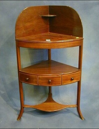 A Georgian mahogany corner wash stand with undertier fitted a drawer, raised on splayed supports 24"