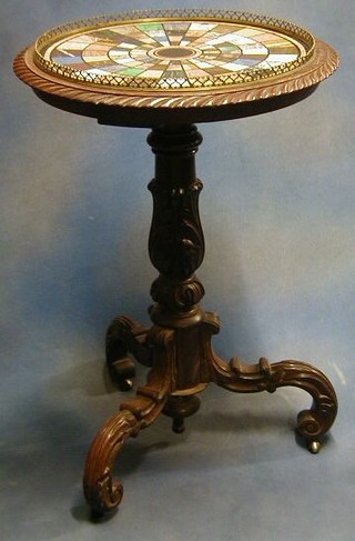 A fine quality William IV mahogany circular marble specimen table, the top inlaid numerous specimens of marble, with brass three-quarter gallery and raised on a turned and carved mahogany pillar and tripod support