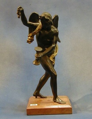 A 19th Century bronze figure of a standing winged God with hour glass and garland, raised on an oak plinth 17"