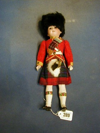 A 19th Century Armand Marseille porcelain headed costume doll of a Scotts soldier in Highland uniform, the head incised 1894 AM/4D EP made in German