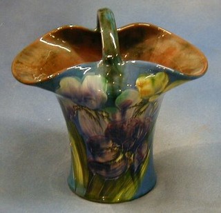 A Torquay pottery basket shaped flower vase with floral decoration, the base impressed signature mark, Torquay 10"