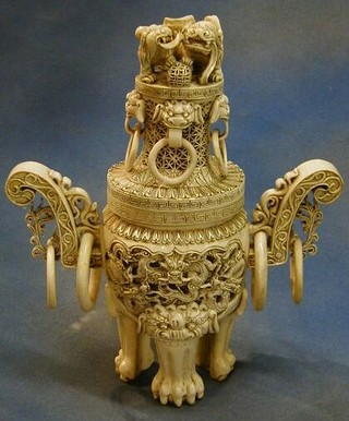 An Eastern pierced ivory twin handled urn and cover 14"