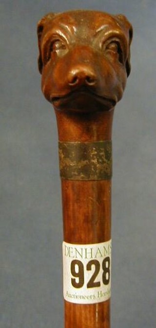 A Victorian carved walking stick the handle in the form of a dogs head