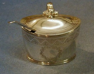 A George III oval engraved silver mustard pot with blue glass liner and hinged lid, London 1815, together with a Georgian silver fiddle pattern mustard spoon