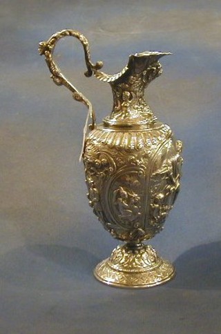 A 19th Century Italian embossed silver ewer decorated classical scenes, 30ozs