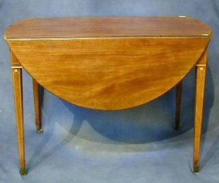 A Georgian mahogany Pembroke table fitted a drawer raised on square tapering supports ending in brass caps and castors 40"