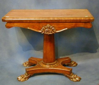 A William IV mahogany card table raised on column supports with triform base and paw feet 36"