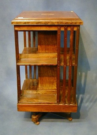 An Edwardian square inlaid rosewood revolving bookcase 19"