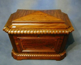 A fine quality 19th Century carved mahogany wine cooler of sarcophagus form with hinged lid by Gillows marked L545 31"