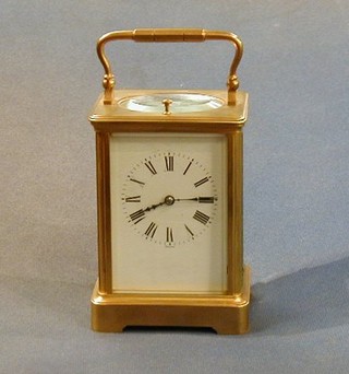 A 19th Century French quarter repeating carriage clock with enamelled dial and Roman numerals contained in a gilt metal case signed Chour