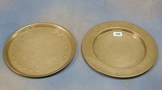 A Tudric planished pewter salver base marked 01289 11" and a circular Homeland pewter salver base marked W & Co 10"