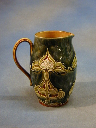 An Art Nouveau Doulton Lambeth stoneware jug, the base impressed Doulton Lambeth 4799Ygg, 8"