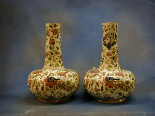 A pair  Zsolnay bottle vases 15" with floral and peacock decoration against a cream ground, printed mark to base 