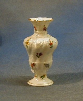 A Nymphenburg porcelain baluster shaped vase with floral decoration 4" the base impressed 527