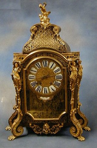 A large and impressive French 19th Century boulle cased clock with porcelain Roman numerals contained in a gilt metal and ormolu case by Millard of Paris (no pendulum)