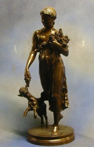 H. Luppins & Co., the founder H.Luppins & Co, a 19th Century bronze figure of a standing girl with goat raised on a circular naturalistic base 25"