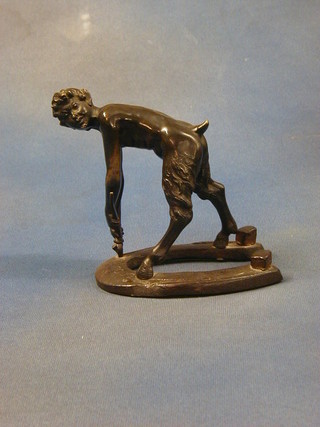 A 19th Century bronze figure of a faun removing nails from a horse shoe 6"
