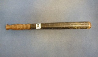 A black painted 19th Century turned wooden truncheon painted a crown