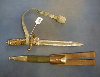 A 19th Century German Salinger double edged hunting dagger with etched blade and stag horn handle decorated Nazi insignia, contained in a leather scabbard