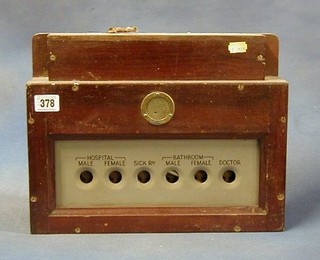 A ships hospital service board indicator contained in a mahogany case