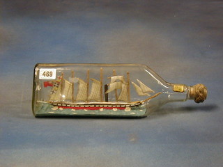 A ship in a bottle "SS Great Britain" contained in a whiskey bottle 13"