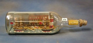 A ship in a bottle "Brigantines at the Anchor" with hotels, cafes, light house and 2 sailing ships 20"