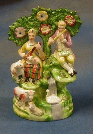 A 19th Century Staffordshire arbour figure group Lady and Gentleman Musicians with animals 8"