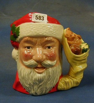 A large Royal Doulton character jug, Santa Claus with toy stack handle, the base marked Santa Claus D6690