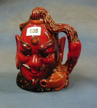 A large Royal Doulton flambe character jug, Aladdins Genie, no. 1055 complete with certificate