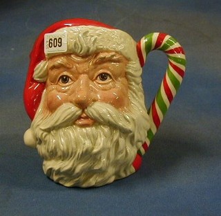 A large Royal Doulton character jug, Santa Claus with green and white candy stick handle, base marked D6840, special edition, of 1000 American Collector's Society