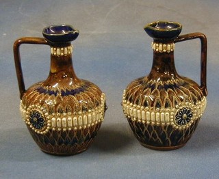 A pair of Royal Doulton jugs, bases marked Royal Doulton and incised RH 6"